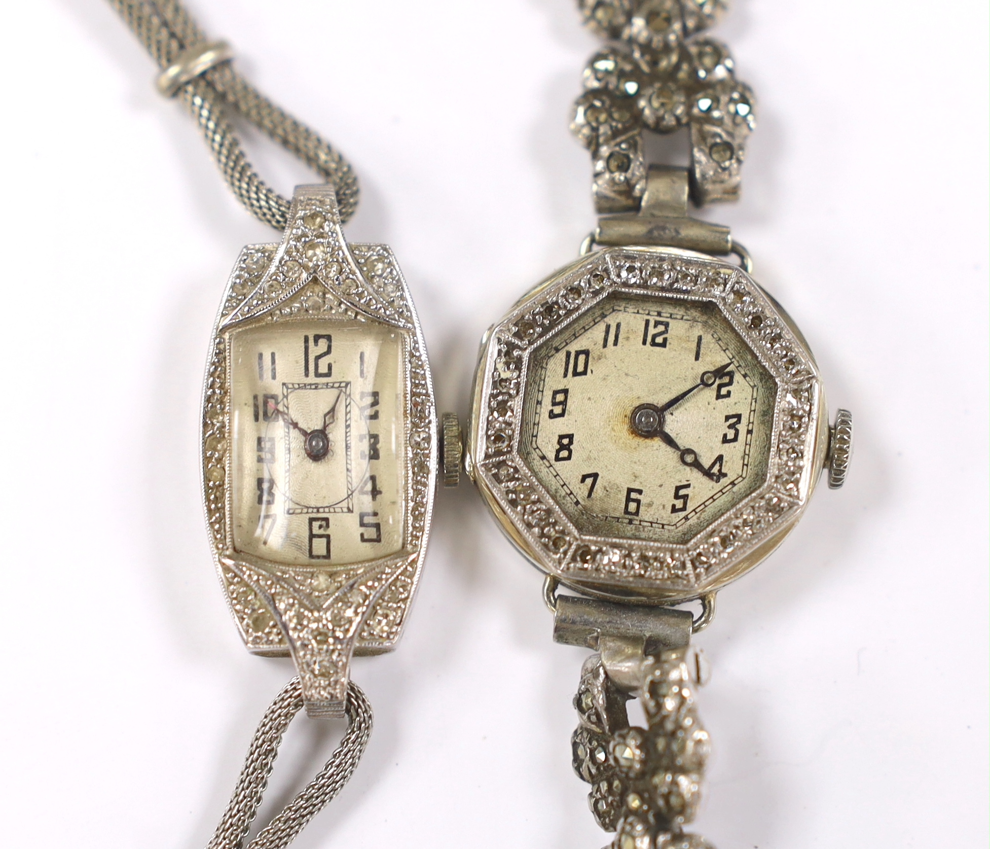 A lady's 18k and diamond set manual wind octagonal cocktail watch, a marcasite set steel bracelet and one other white metal and diamond chip set cocktail watch on a steel mesh bracelet.